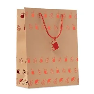 Bolsa de papel kraft navideña con etiqueta de regalo